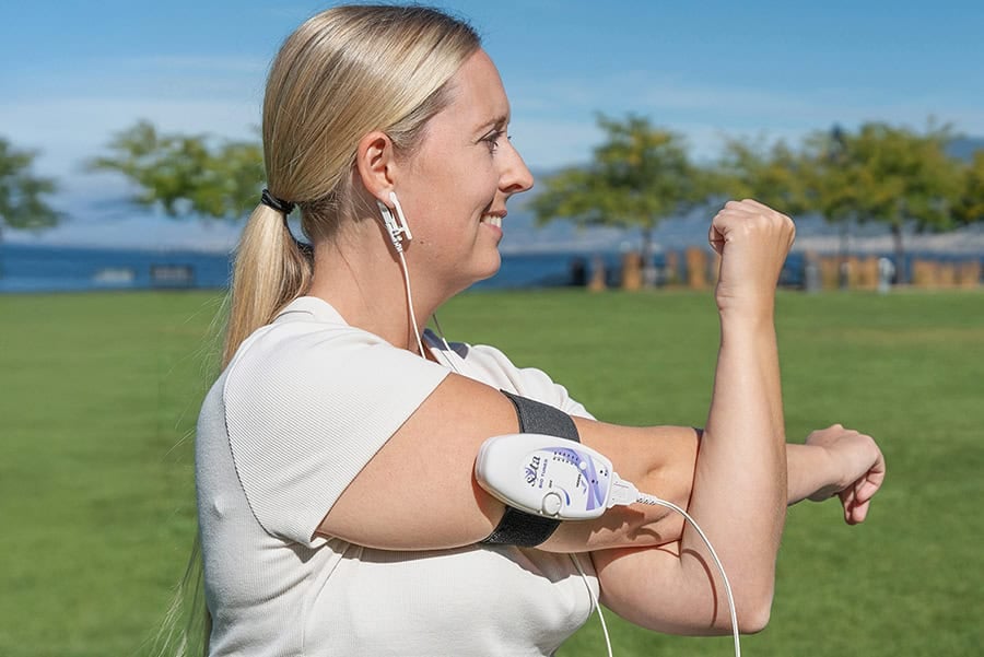 Woman using the SOTA Bio Tuner outdoors