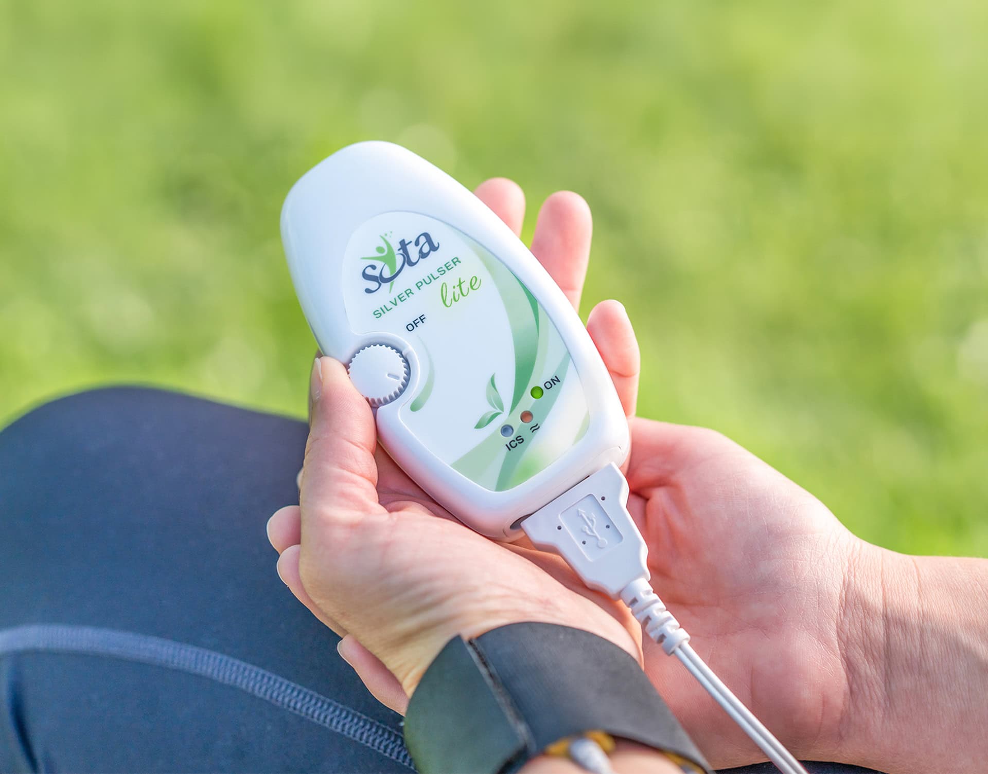 Wearing the Silver Pulser Lite on the wrist for Micropulsing.