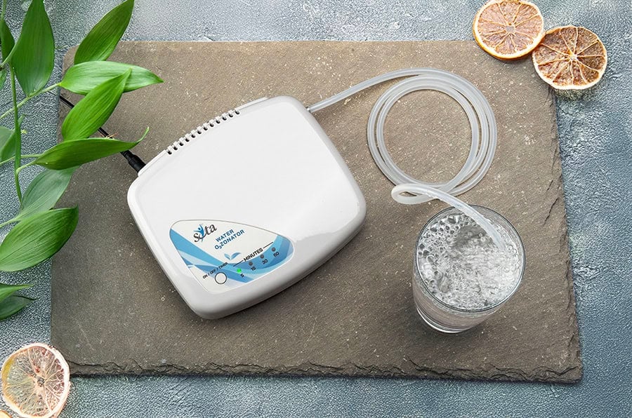 Ozonating water beside a plant