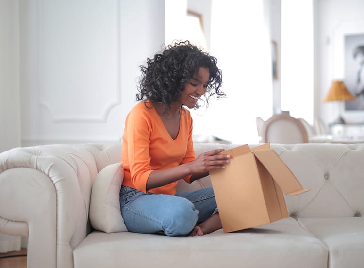 Woman opening package